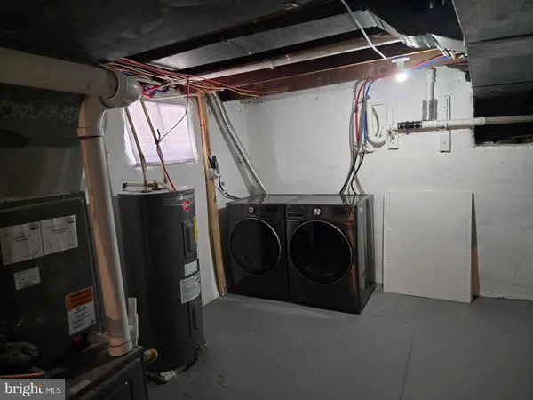 a utility room with dryer and washer