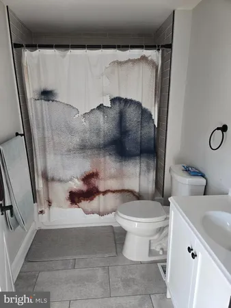 a bathroom with a toilet and a sink