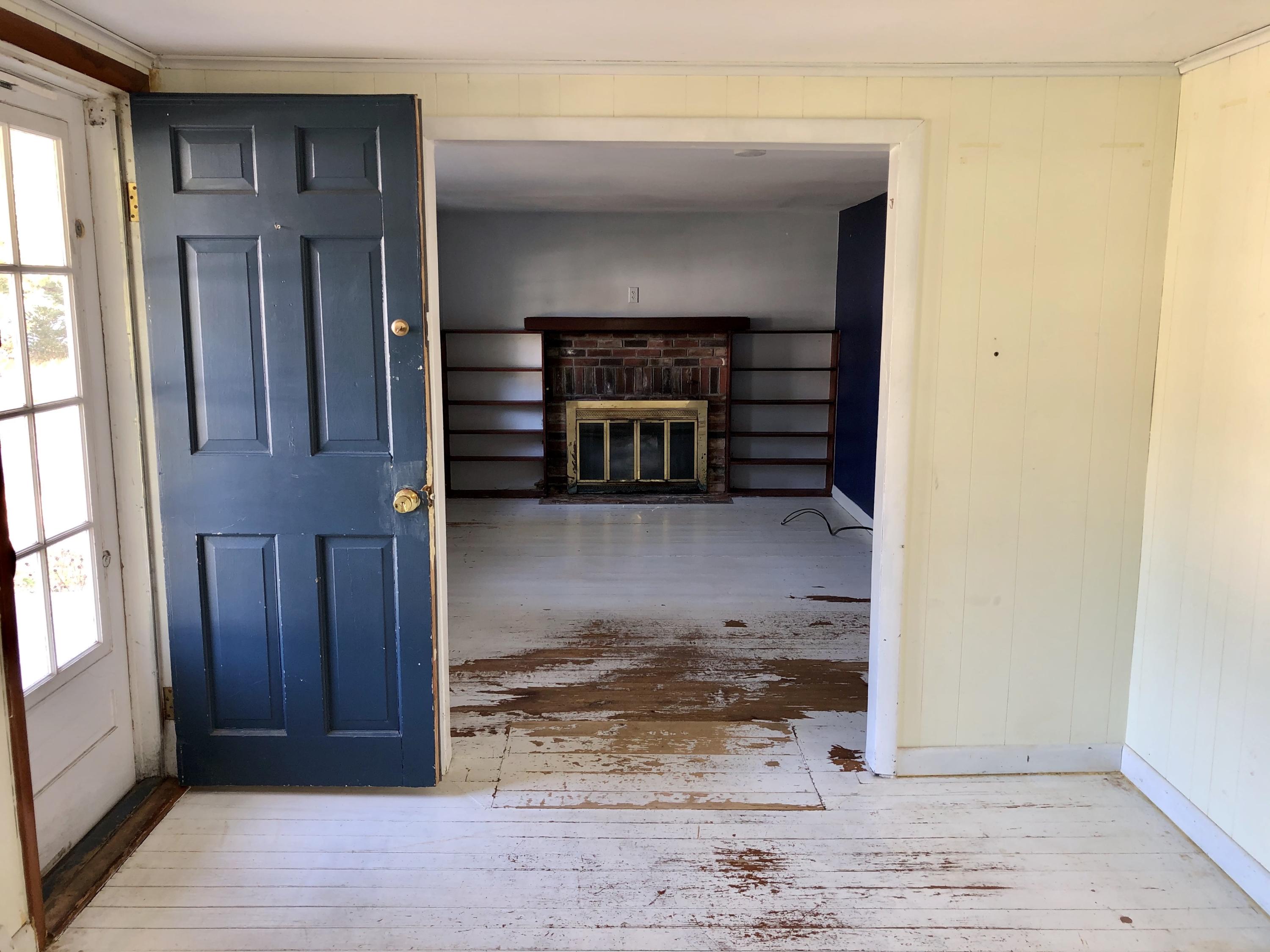 23 Kendrick Road Harwich, MA 02645 - Photo 12 of 13 a view of a livingroom with wooden floor and a fireplace
