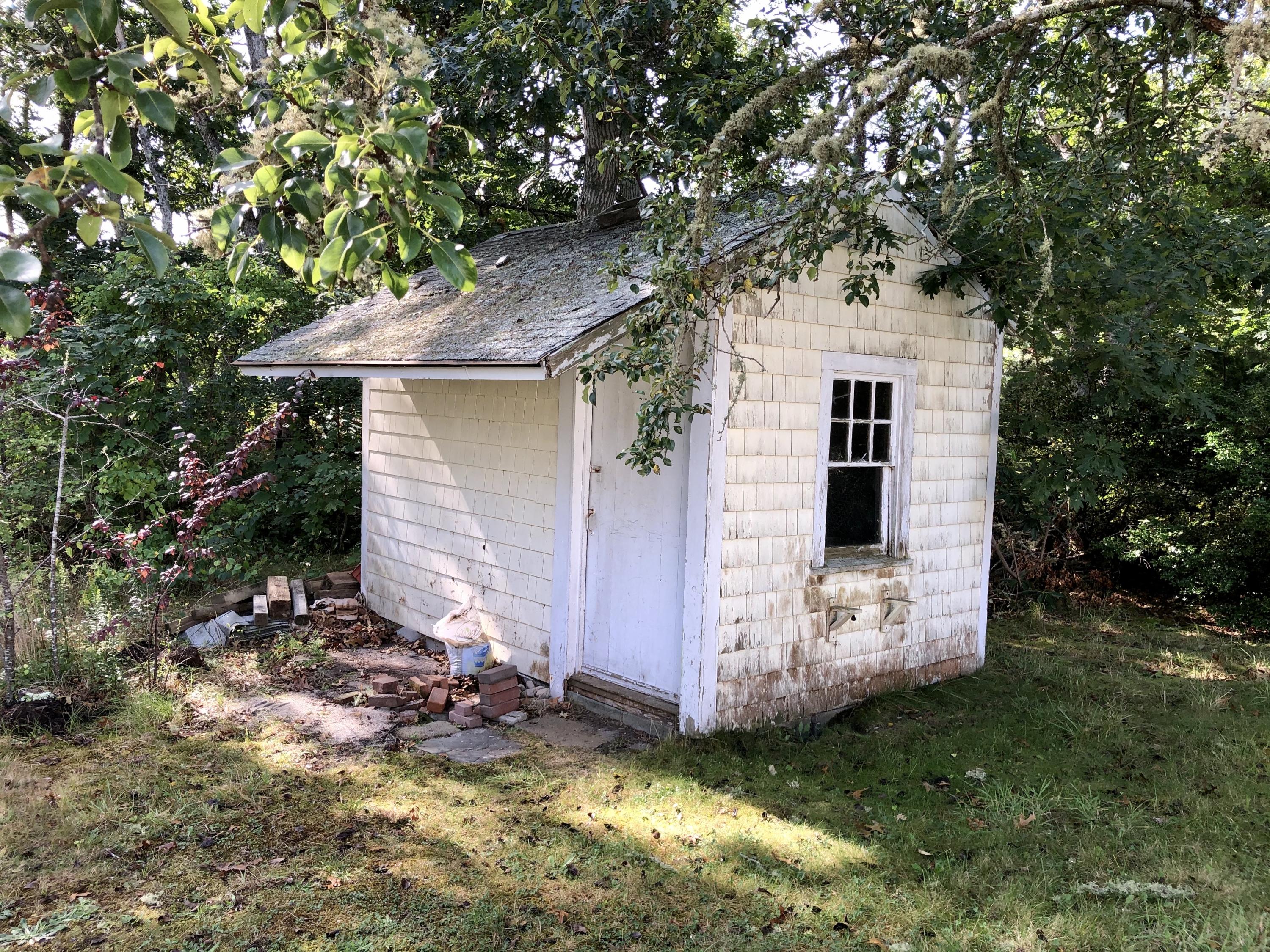 23 Kendrick Road Harwich, MA 02645 - Photo 4 of 13 a view of a backyard with plants and large tree