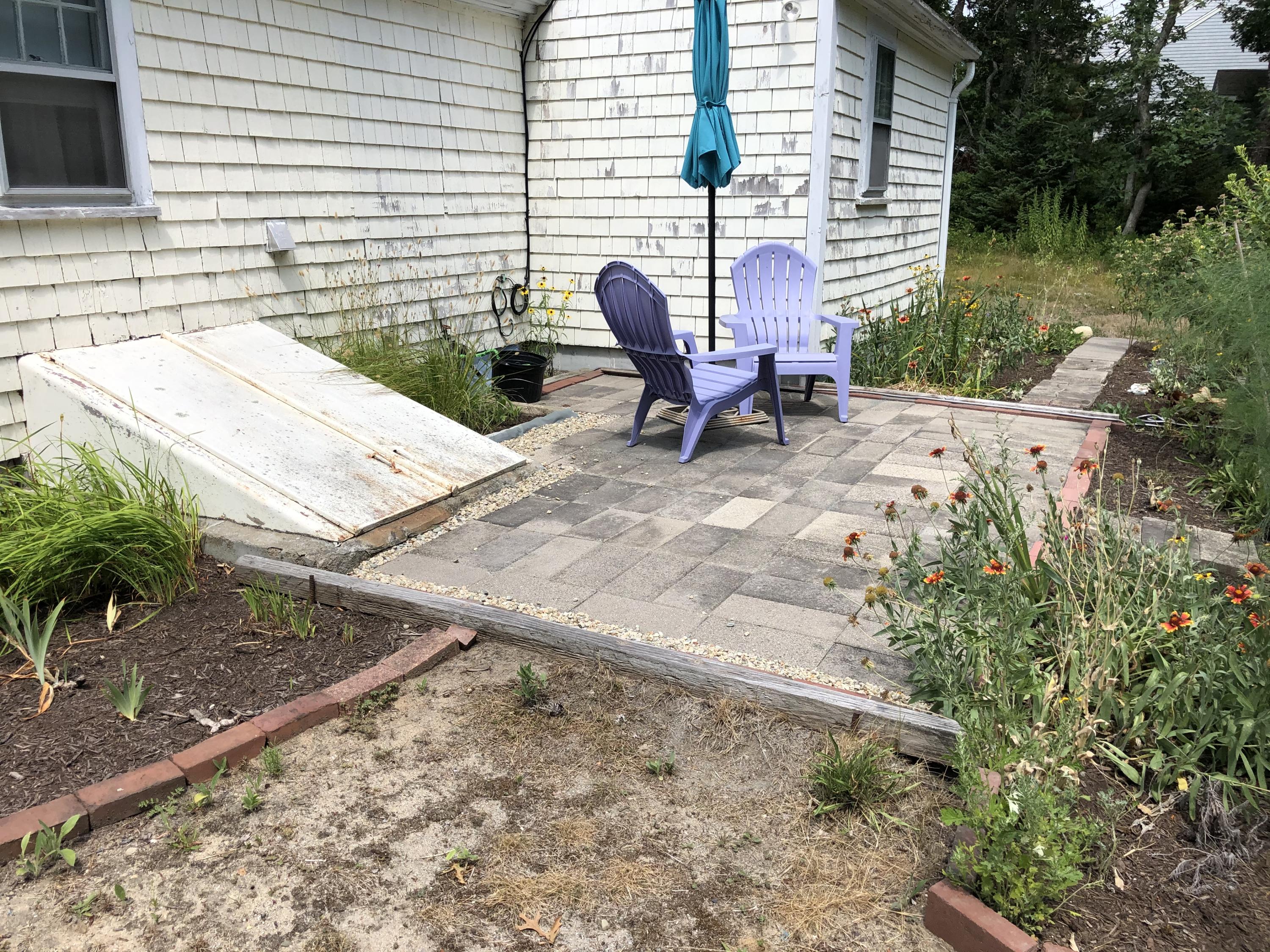 23 Kendrick Road Harwich, MA 02645 - Photo 5 of 13 a view of a lounge chairs in back yard of the house