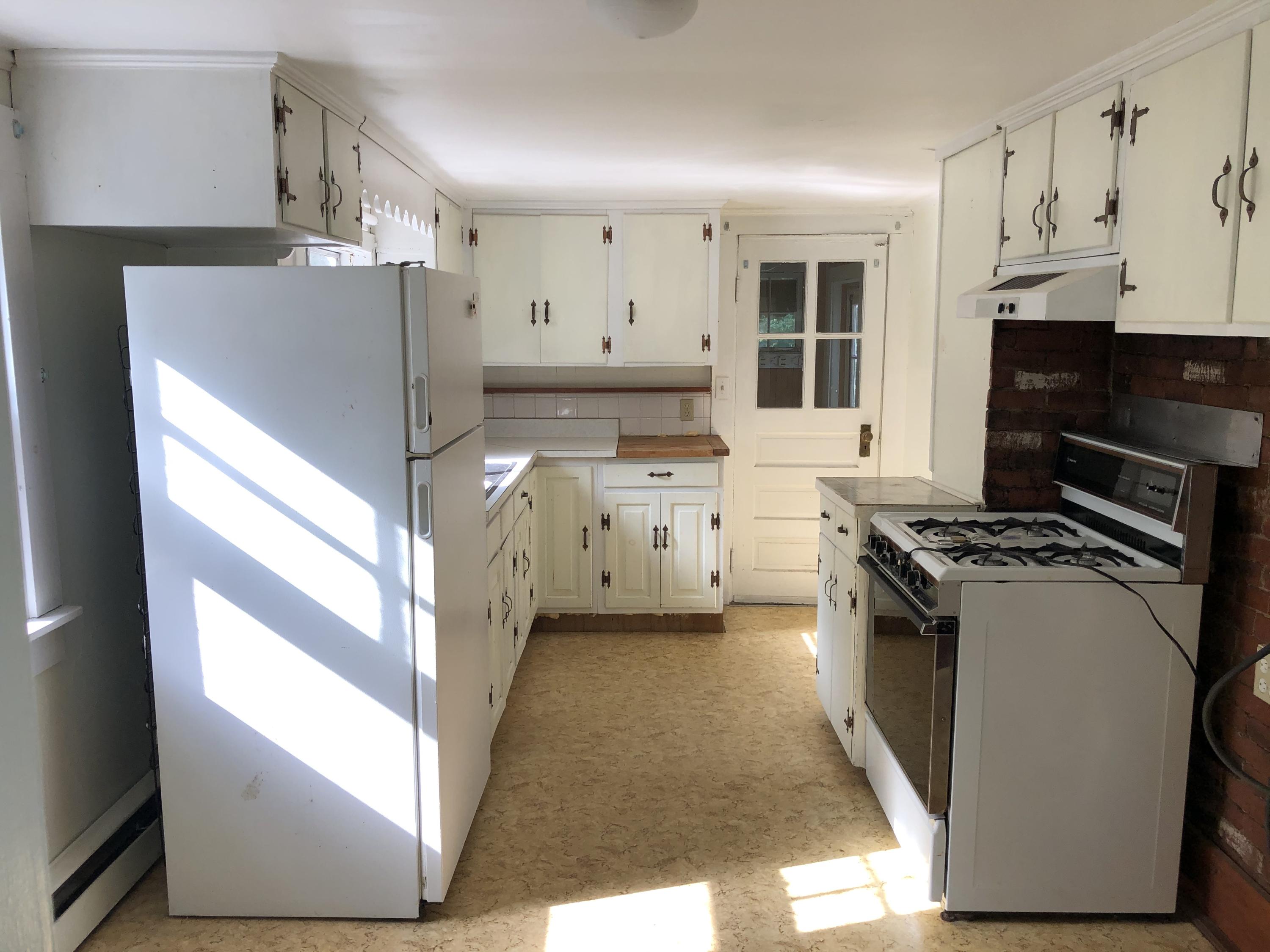 23 Kendrick Road Harwich, MA 02645 - Photo 10 of 13 a kitchen with a stove a refrigerator and a sink