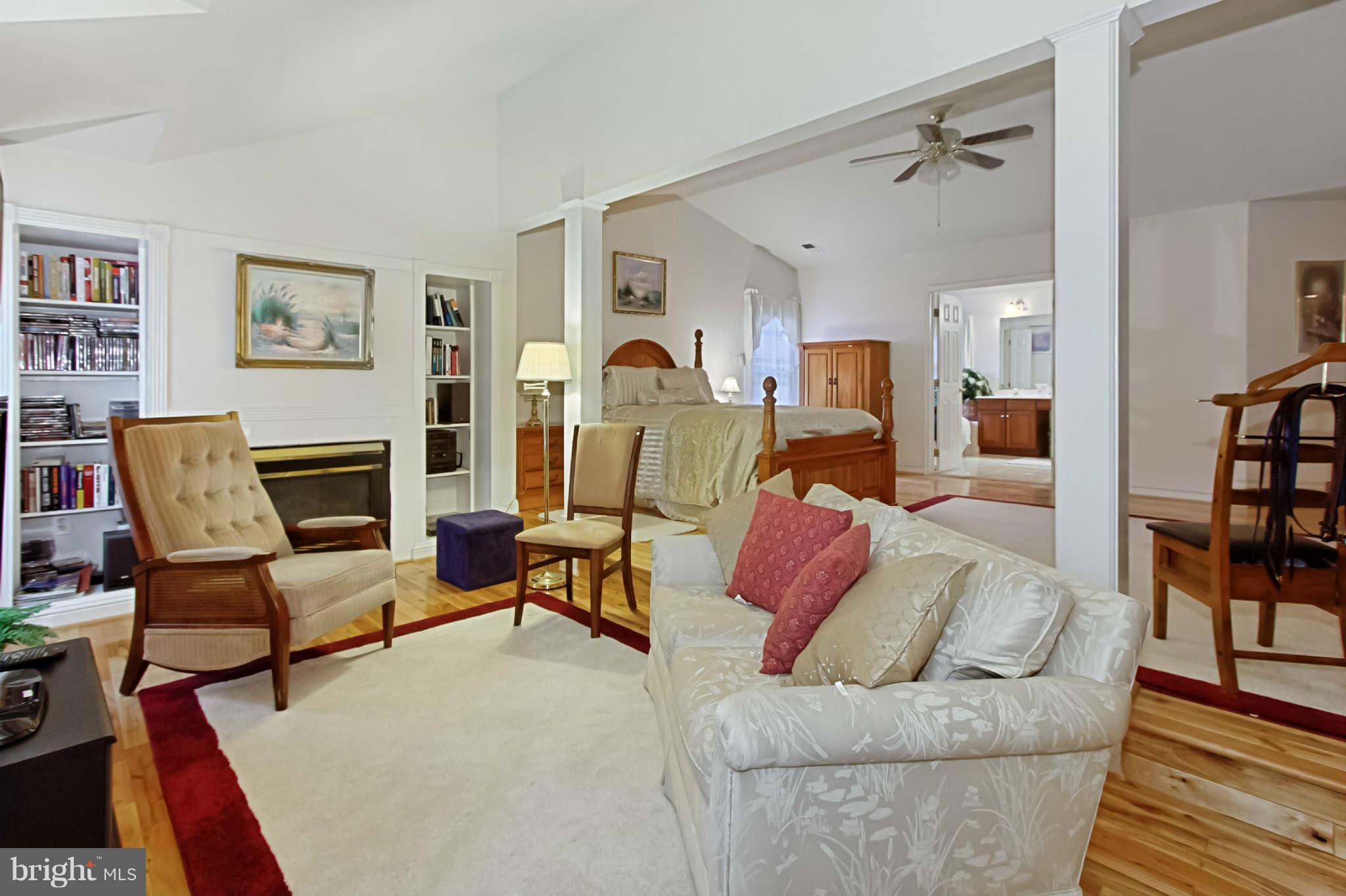 8635 Tuttle Road, Unit 2 Springfield, VA 22152 - Photo 17 of 30 a living room with furniture fireplace and rug