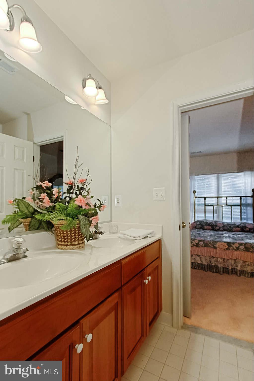 8635 Tuttle Road, Unit 2 Springfield, VA 22152 - Photo 22 of 30 a bathroom with a sink and a mirror
