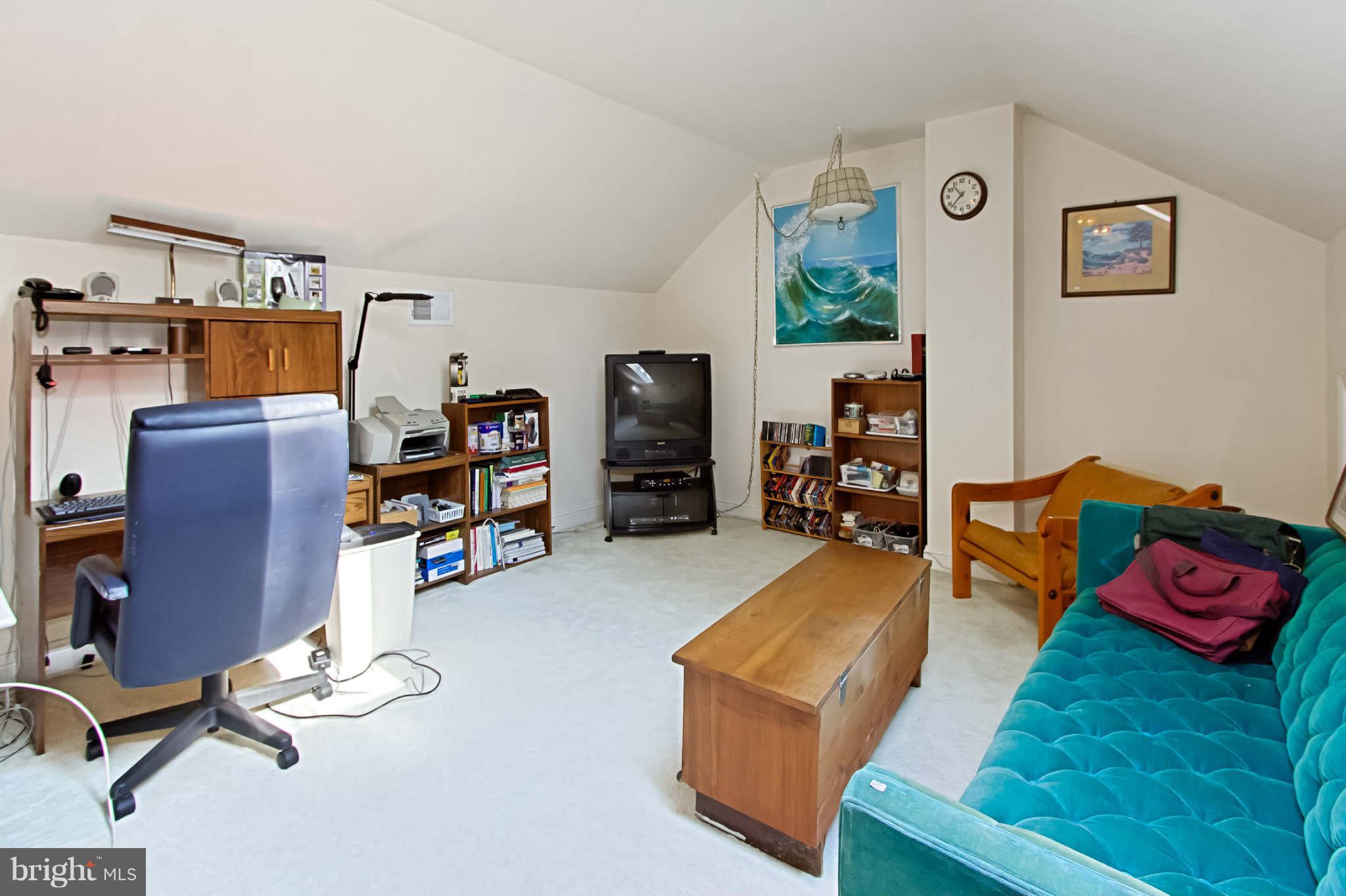 8635 Tuttle Road, Unit 2 Springfield, VA 22152 - Photo 24 of 30 a view of a livingroom with workspace and a couch