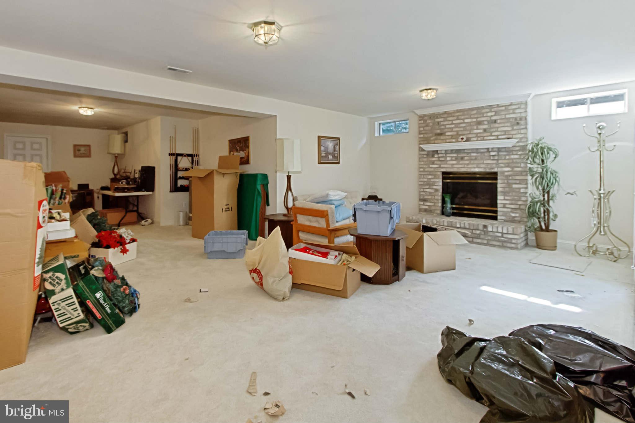 8635 Tuttle Road, Unit 2 Springfield, VA 22152 - Photo 27 of 30 a room with furniture and a fireplace