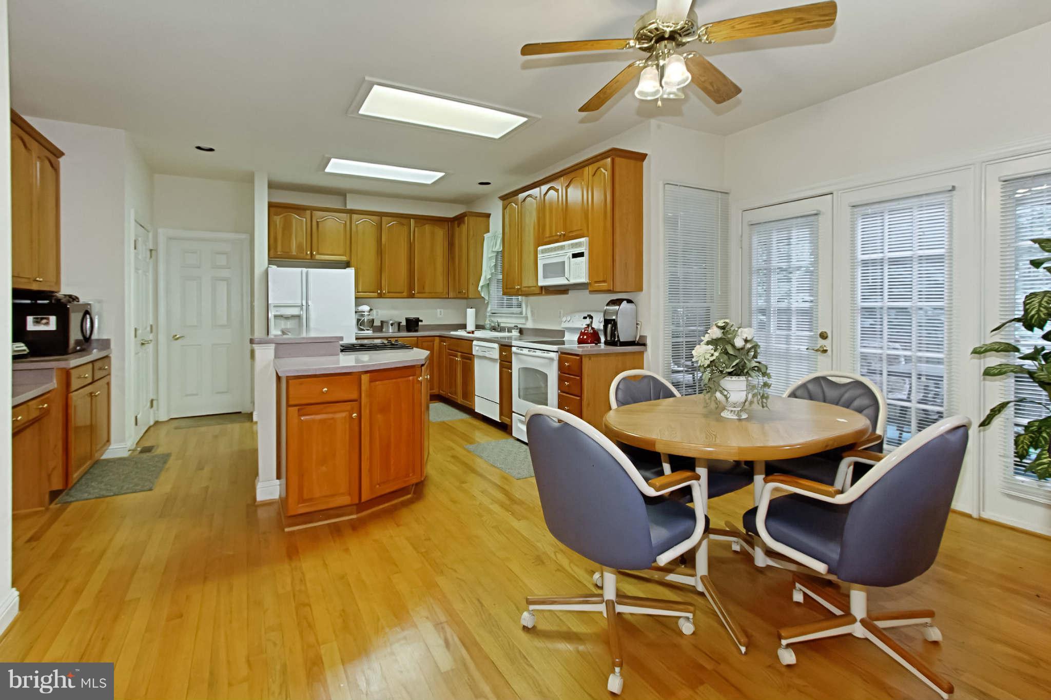 8635 Tuttle Road, Unit 2 Springfield, VA 22152 - Photo 10 of 30 a view of a dining room with furniture and wooden floor