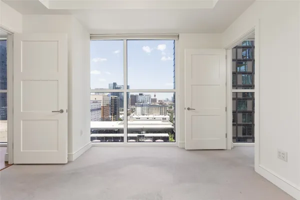a bathroom with a granite countertop sink a toilet and shower