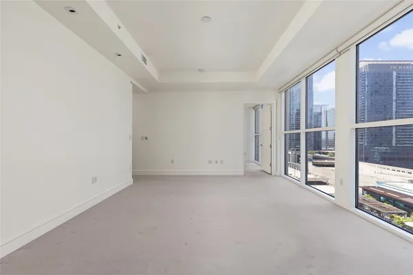 a view of empty room with floor to ceiling window