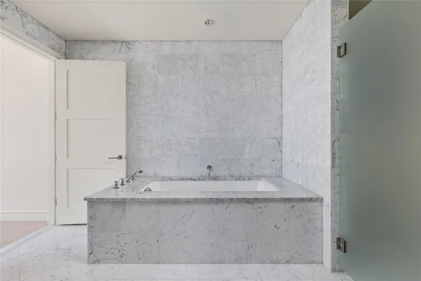 a bathroom with a double vanity sink and mirror