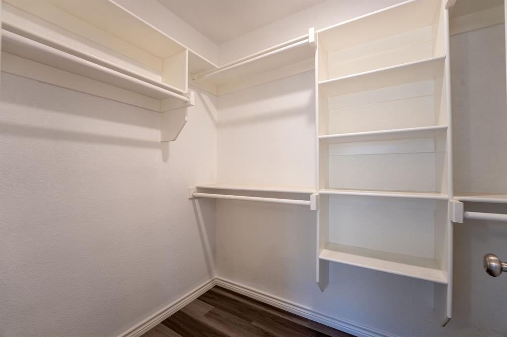 1020 Springview Lane Mabank, TX 75147 - Photo 9 of 15 Walk in closet with dark wood finished floors