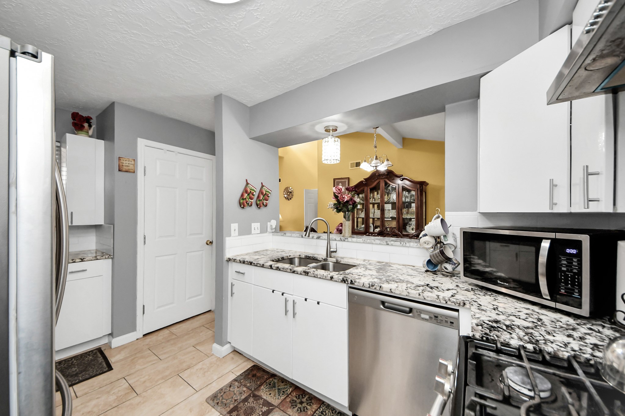 4155 Amir Street Houston, TX 77072 - Photo 22 of 43 a kitchen with appliances cabinets and a sink
