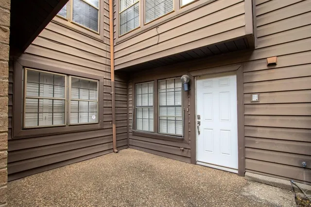 a view of house with window and wooden fence