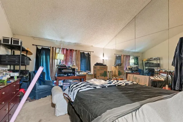 a bed room with a bed and a book shelf