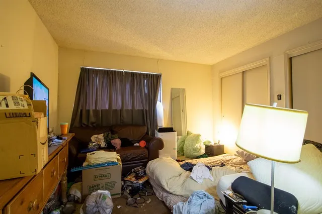 a bed room with furniture and a window