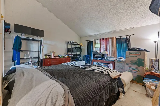 a bed room with a bed and a furniture