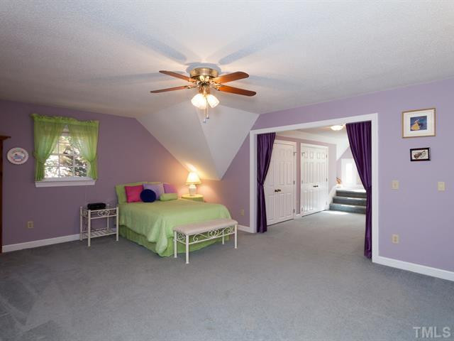 1929 Partridge Berry Drive Raleigh, NC 27606 - Photo 15 of 25 Upstairs you'll find a spacious bedroom that includes a dressing area with tons of closet space. Bedroom