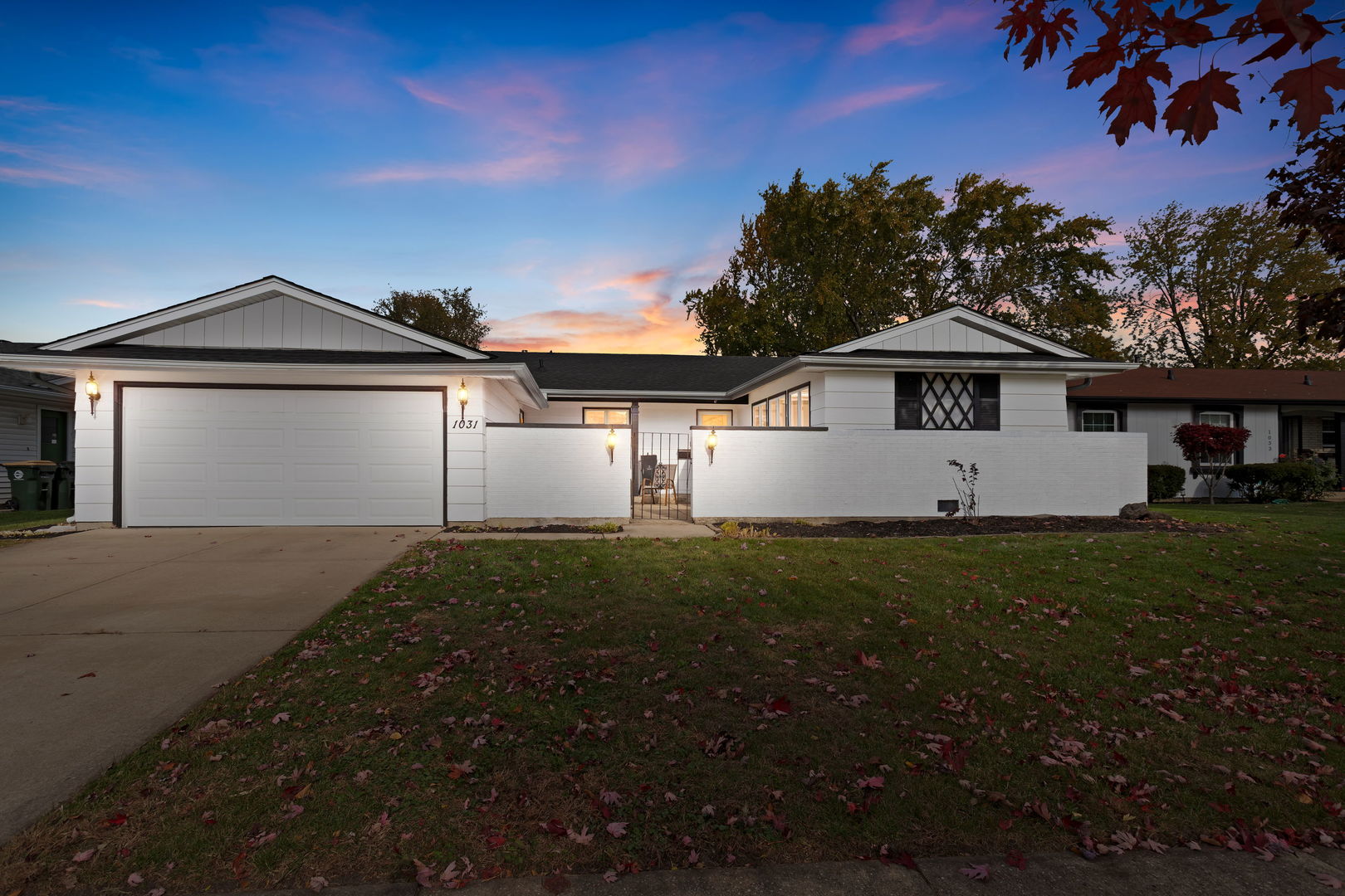 1031 Conrad Court Elk Grove Village, IL 60007 - Photo 1 of 17 a front view of a house with a yard and garage