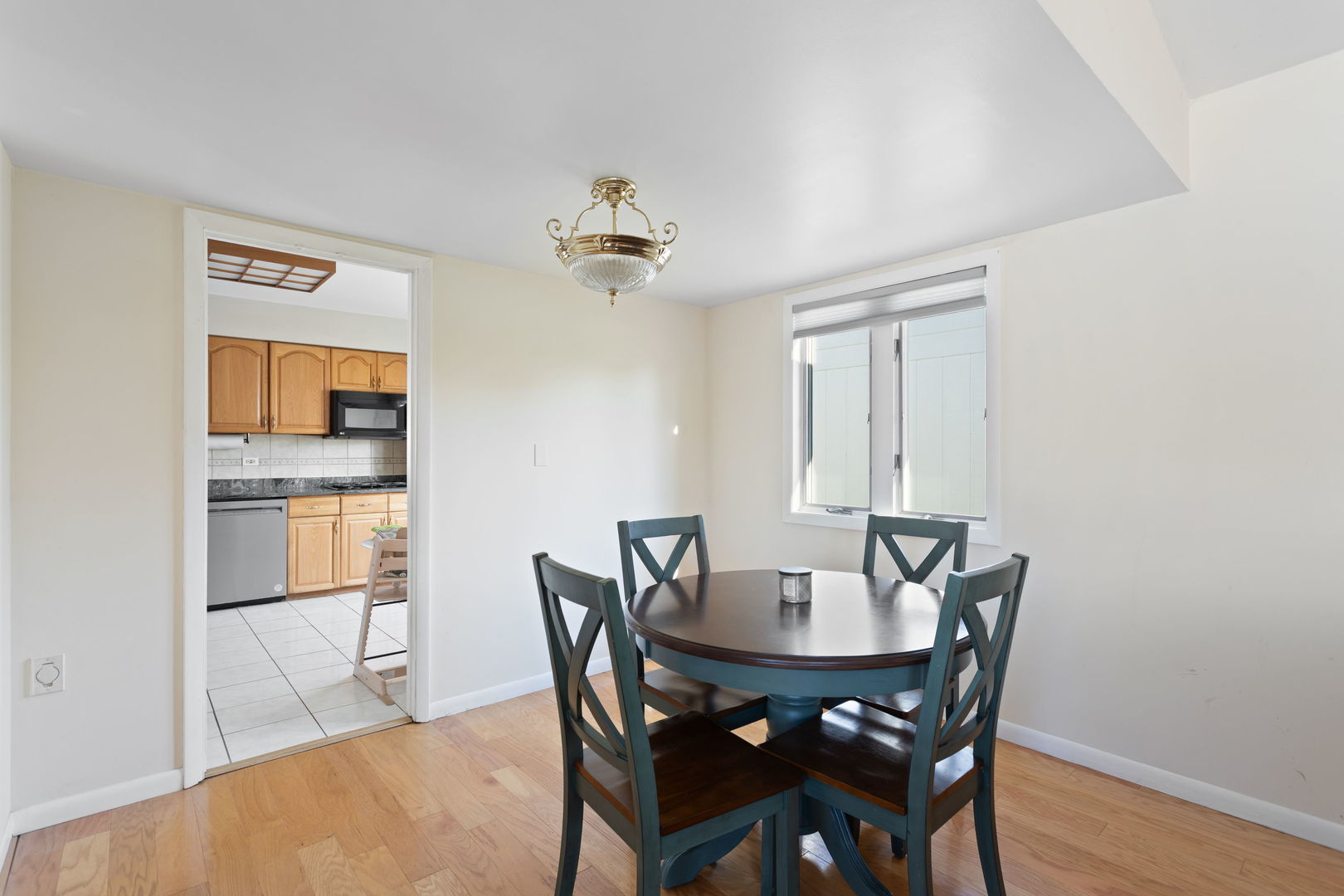 1031 Conrad Court Elk Grove Village, IL 60007 - Photo 5 of 17 a view of a dining room with furniture and wooden floor