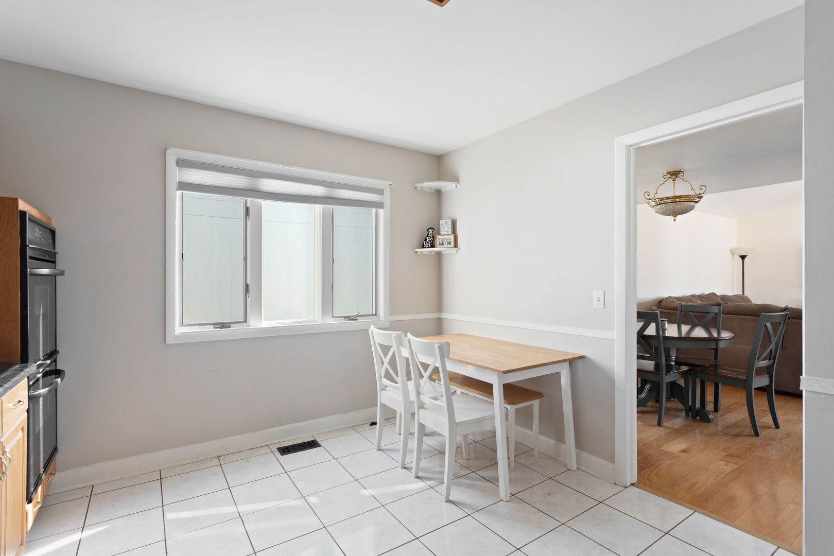 1031 Conrad Court Elk Grove Village, IL 60007 - Photo 7 of 17 a view of a dining room with furniture