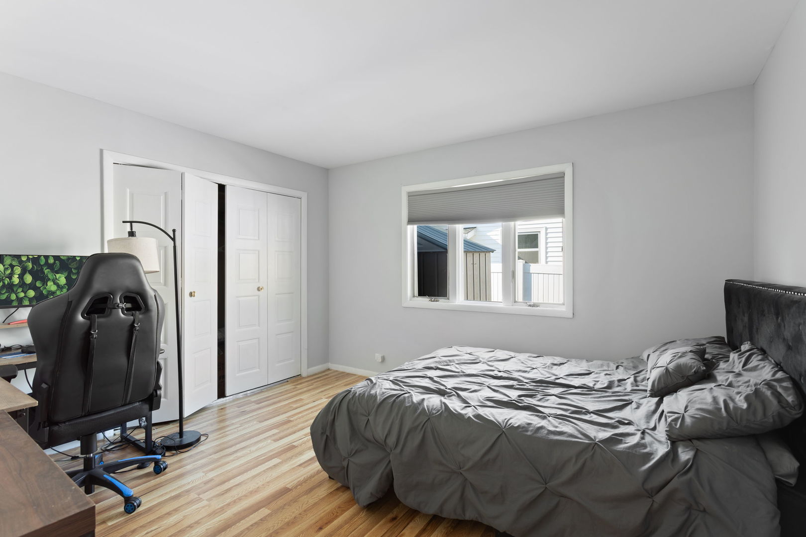 1031 Conrad Court Elk Grove Village, IL 60007 - Photo 10 of 17 a bedroom with a bed and a window