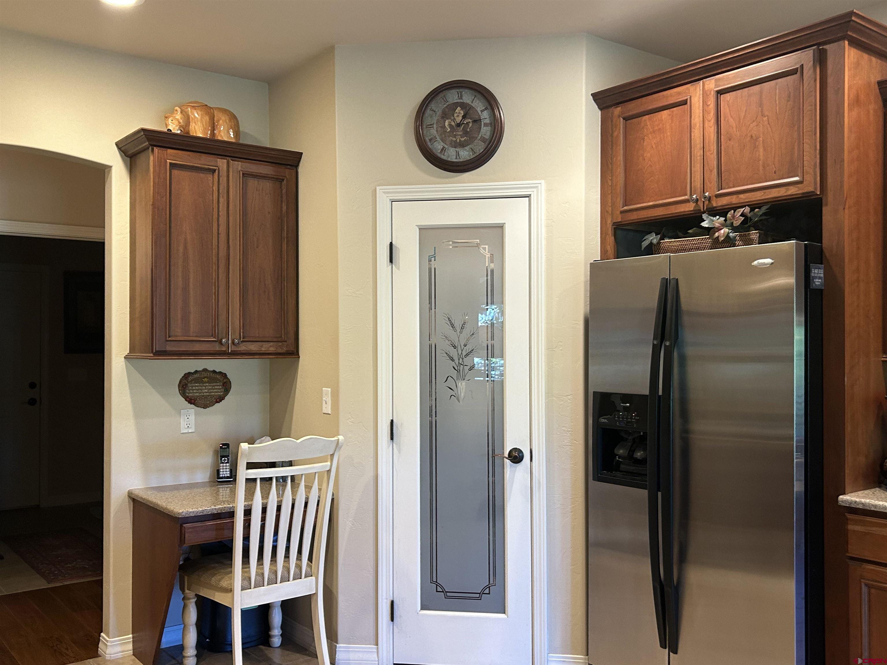 850 Southeast Pinyon Street Cedaredge, CO 81413 - Photo 16 of 45 a kitchen with a refrigerator a stove a washer and dryer