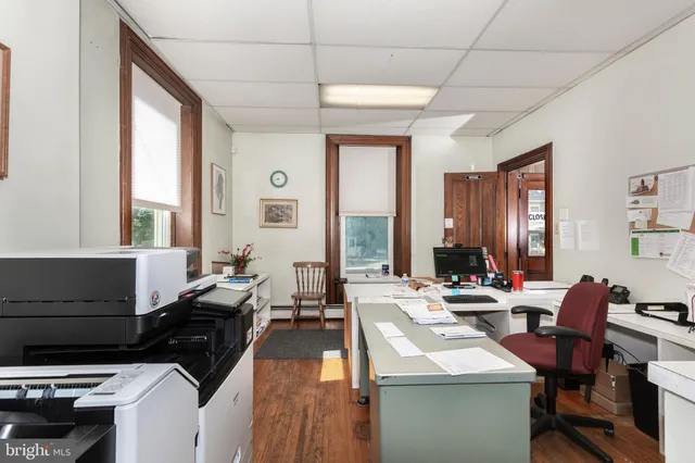 a bathroom with a sink toilet and mirror