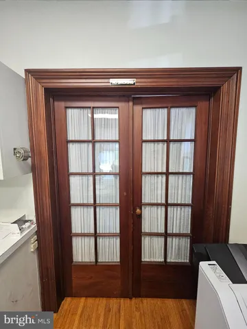 a kitchen with white cabinets and sink