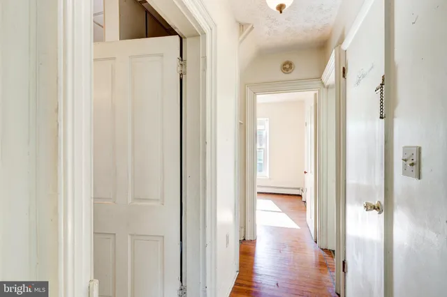 a view of a hallway with washer and dryer
