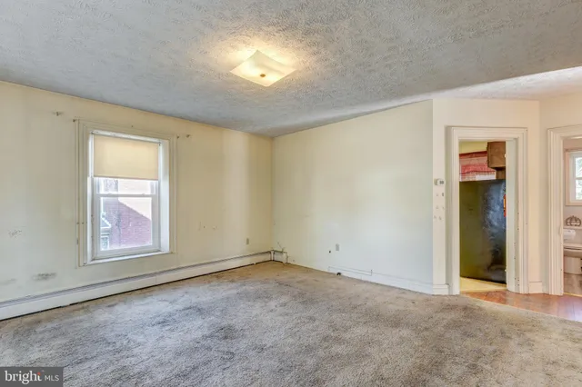 a view of a brick house with a large window