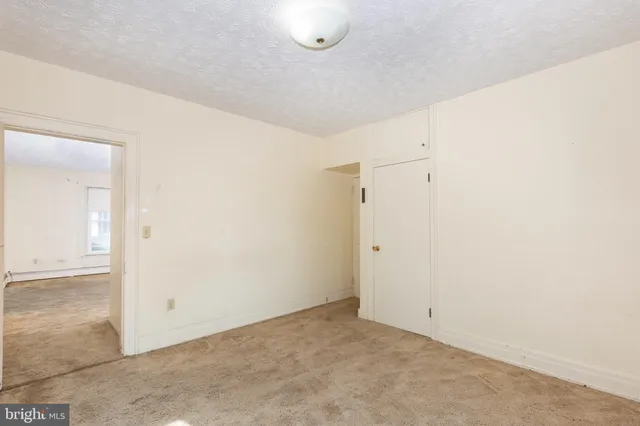 a view of a room with wooden walls