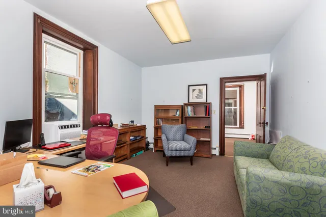 a room with furniture and a chair