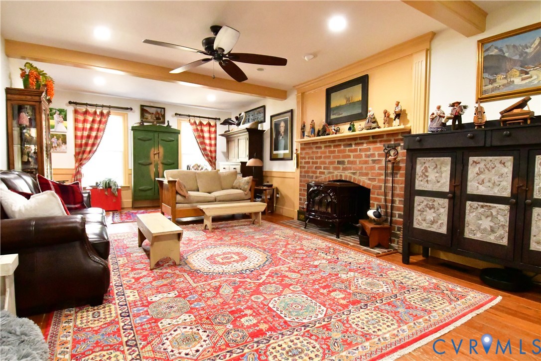 9101 Woodpecker Road Chesterfield, VA 23838 - Photo 12 of 50 a living room with furniture windows and a fireplace