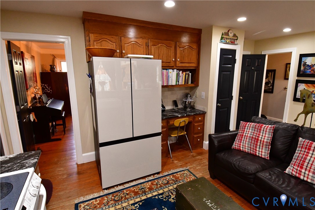 9101 Woodpecker Road Chesterfield, VA 23838 - Photo 19 of 50 Kitchen featuring white appliances, brown cabinetr