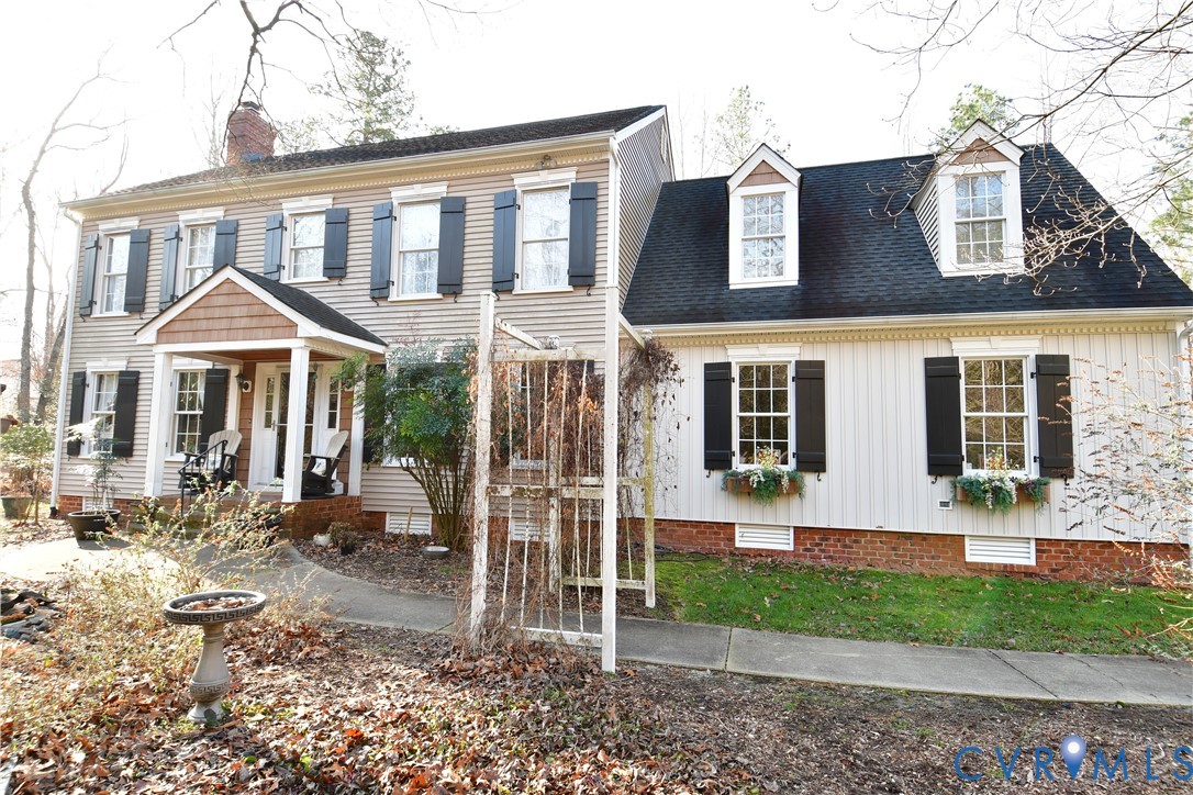 9101 Woodpecker Road Chesterfield, VA 23838 - Photo 2 of 50 a front view of a house with a yard