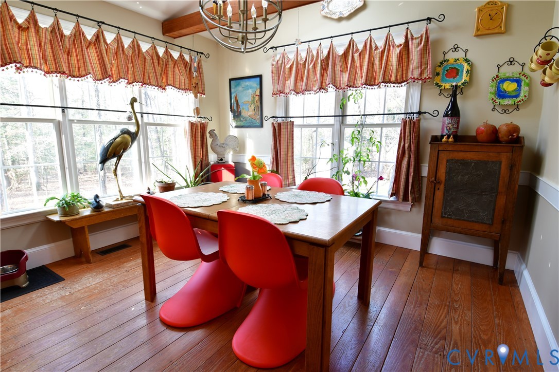 9101 Woodpecker Road Chesterfield, VA 23838 - Photo 21 of 50 a view of a dining room with furniture window and wooden floor