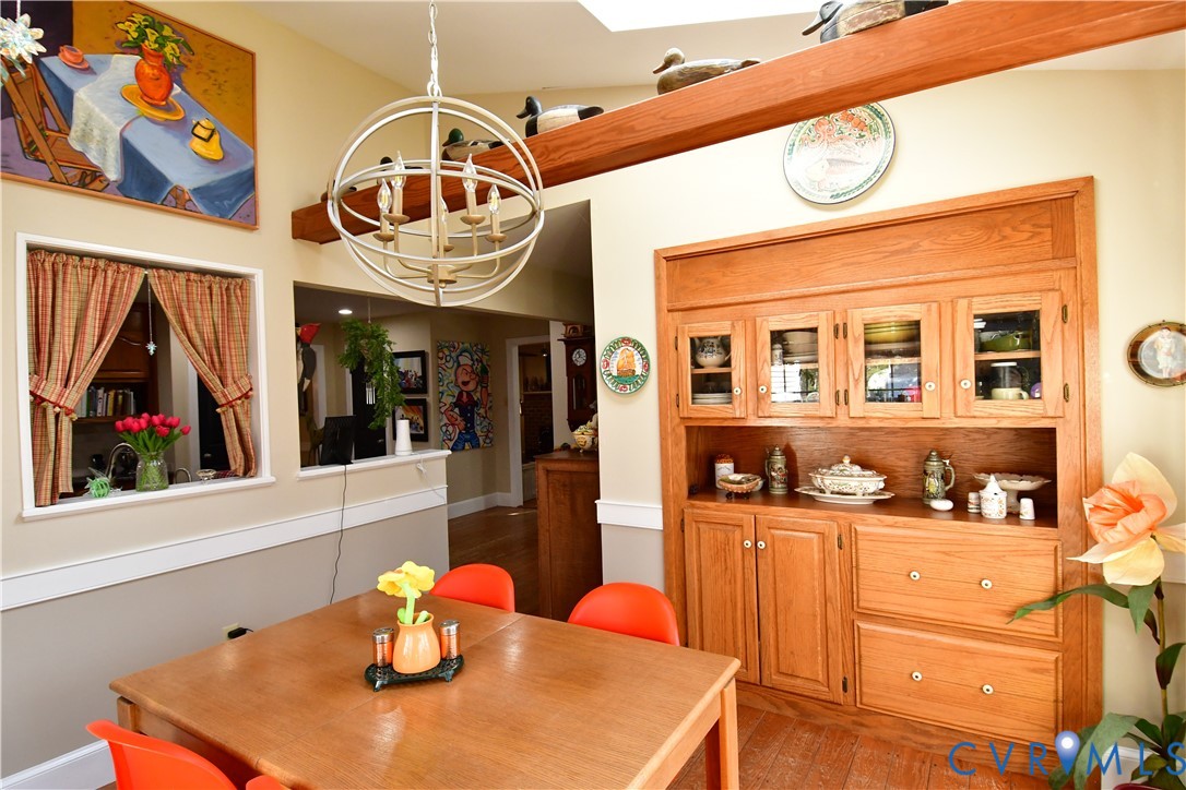 9101 Woodpecker Road Chesterfield, VA 23838 - Photo 22 of 50 Dining area with a chandelier and light wood-type