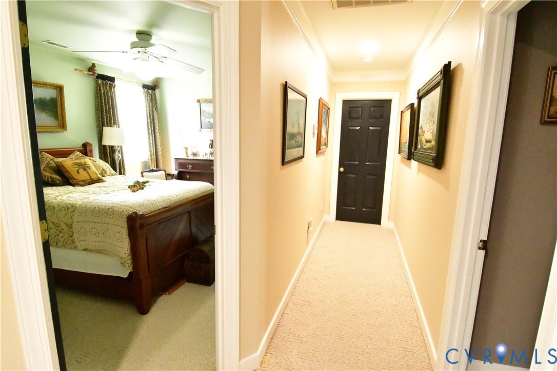 9101 Woodpecker Road Chesterfield, VA 23838 - Photo 28 of 50 Hallway with carpet flooring and baseboards