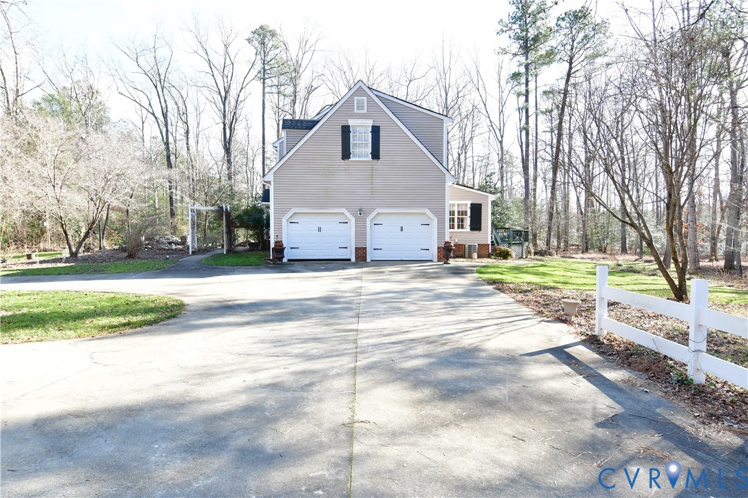 9101 Woodpecker Road Chesterfield, VA 23838 - Photo 3 of 50 a front view of a house with a yard