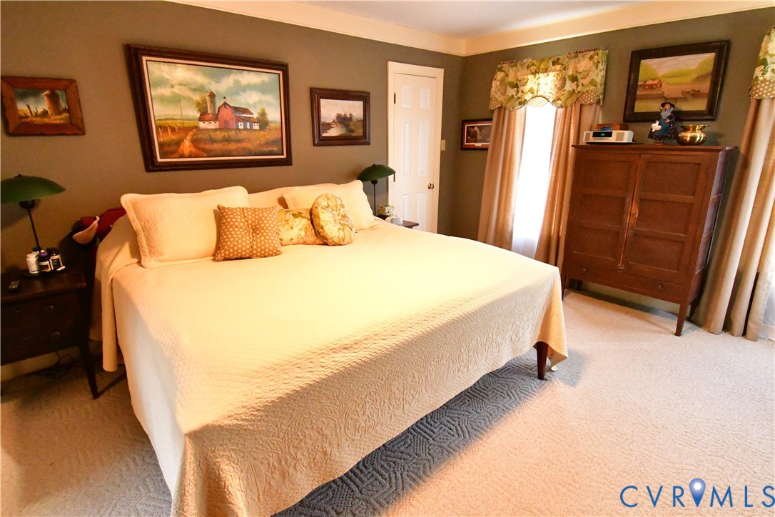 9101 Woodpecker Road Chesterfield, VA 23838 - Photo 33 of 50 Bedroom featuring light colored carpet