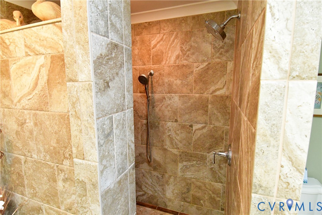 9101 Woodpecker Road Chesterfield, VA 23838 - Photo 38 of 50 primary Full bath featuring a tile shower