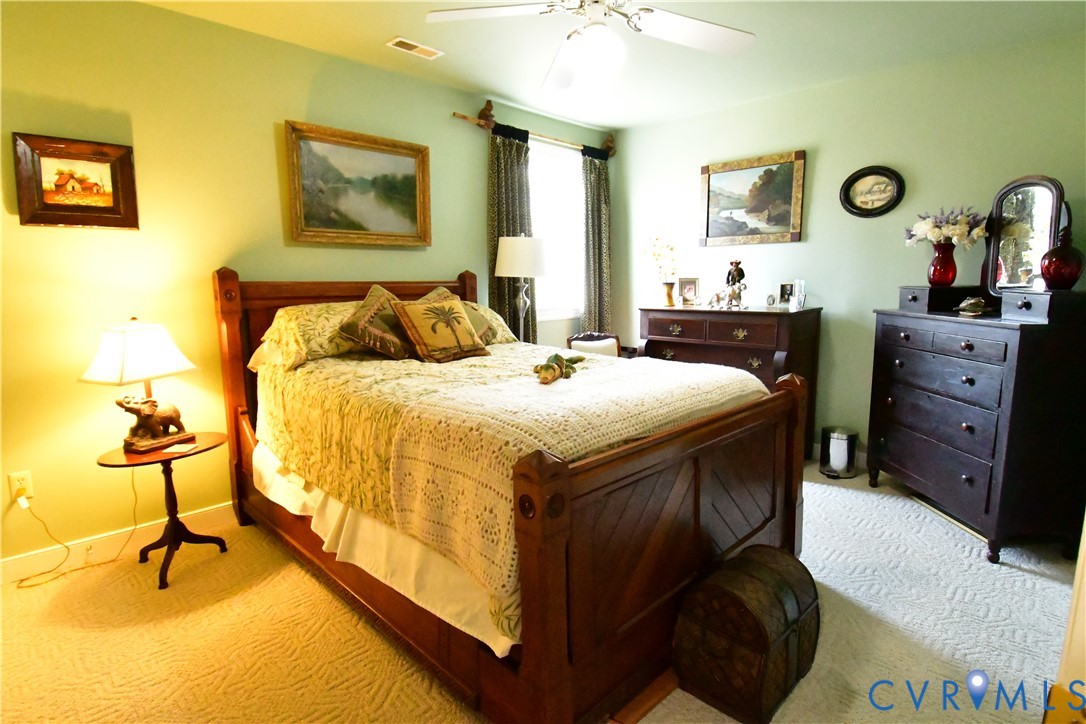 9101 Woodpecker Road Chesterfield, VA 23838 - Photo 41 of 50 a bed room with a bed and chair