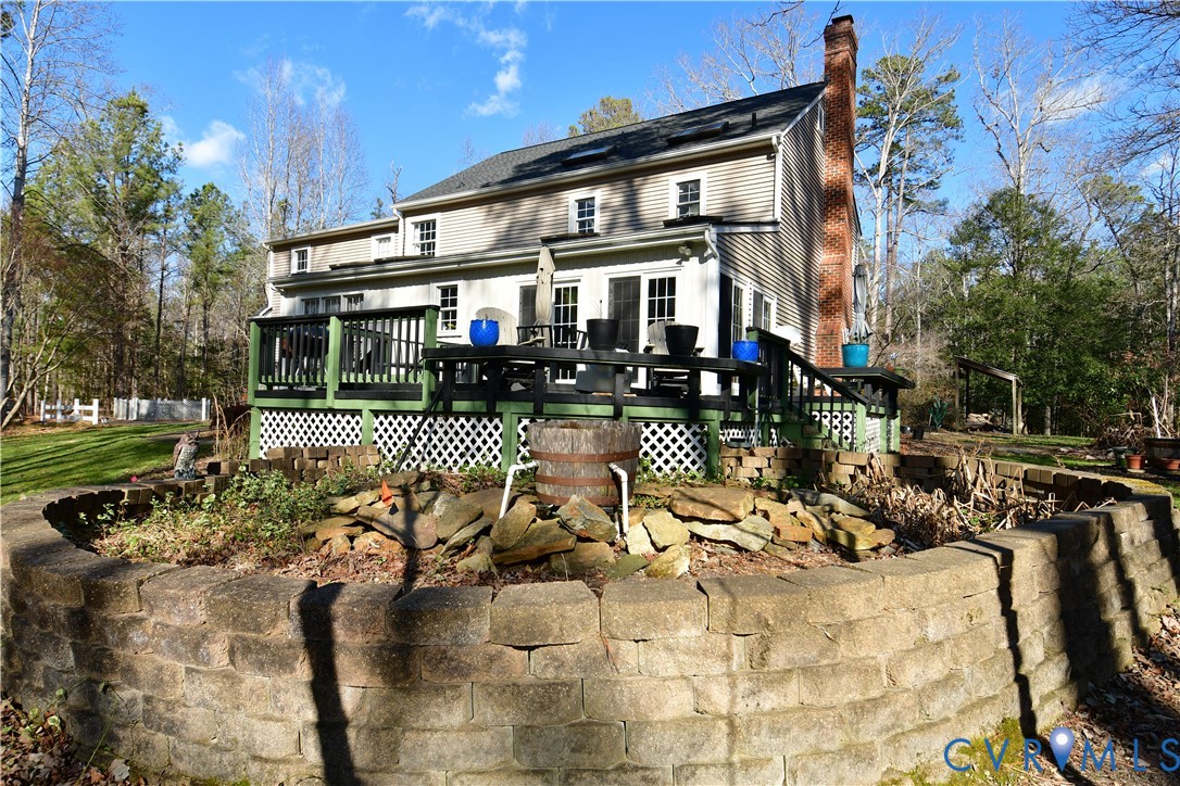 9101 Woodpecker Road Chesterfield, VA 23838 - Photo 6 of 50 a view of a house with backyard water and sitting area