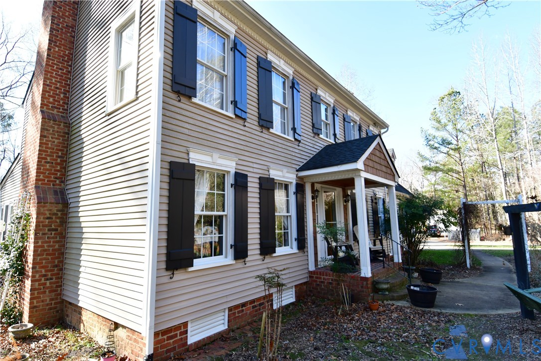 9101 Woodpecker Road Chesterfield, VA 23838 - Photo 8 of 50 a view of a house with a yard and sitting area