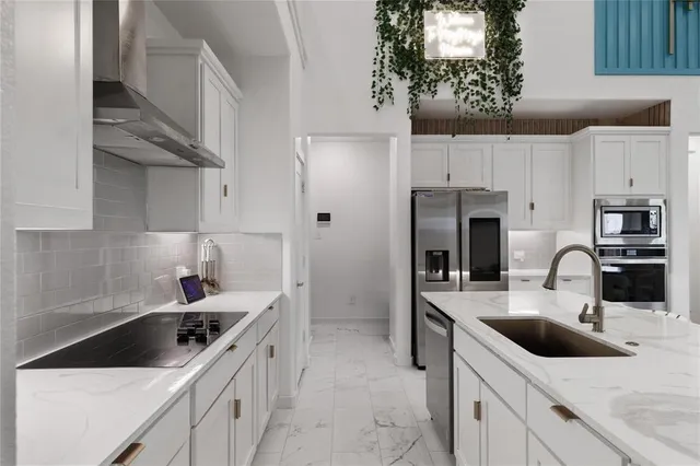 a kitchen with a sink and cabinets