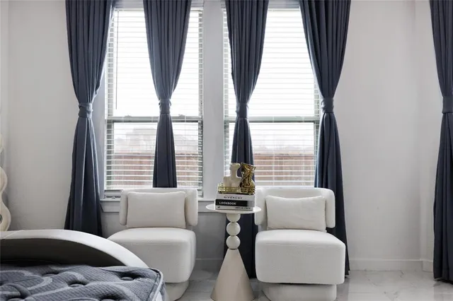 a living room with a flat screen tv and a white door