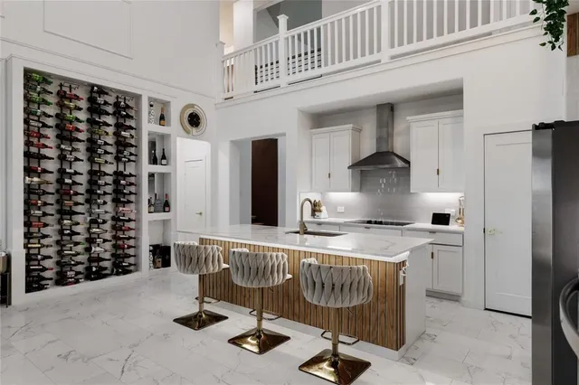 a kitchen with a refrigerator a stove and cabinets