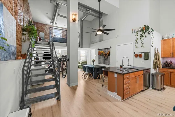 a kitchen with stainless steel appliances granite countertop a stove and a refrigerator