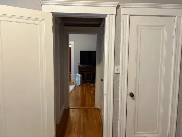 a view of a bathroom from a hallway