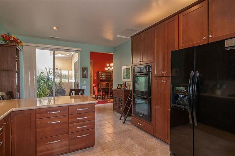 138 Lakeshore Drive Rancho Mirage, CA 92270 - Photo 12 of 24 a room with lots of wooden furniture and a glass door